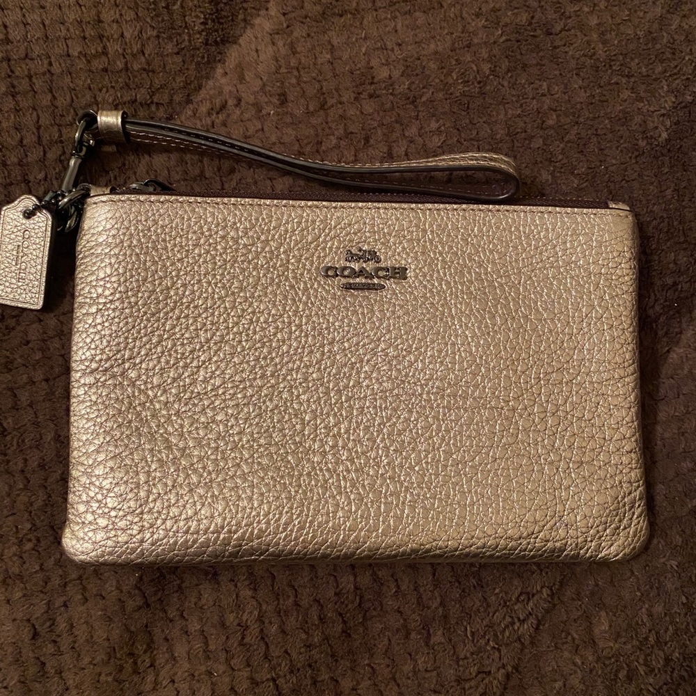Shimmery gold Coach wristlet